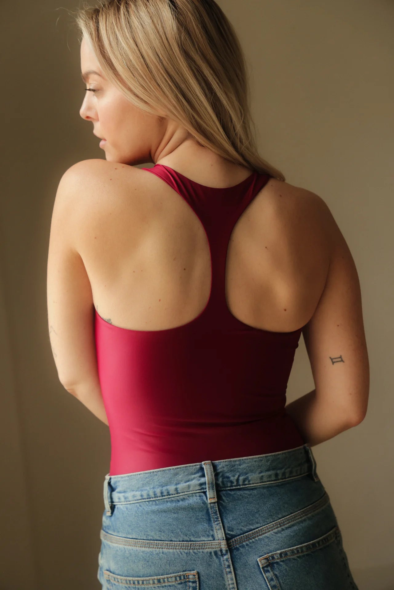 Magnolia Bodysuit Wine. Sustainable women's sports bodysuit